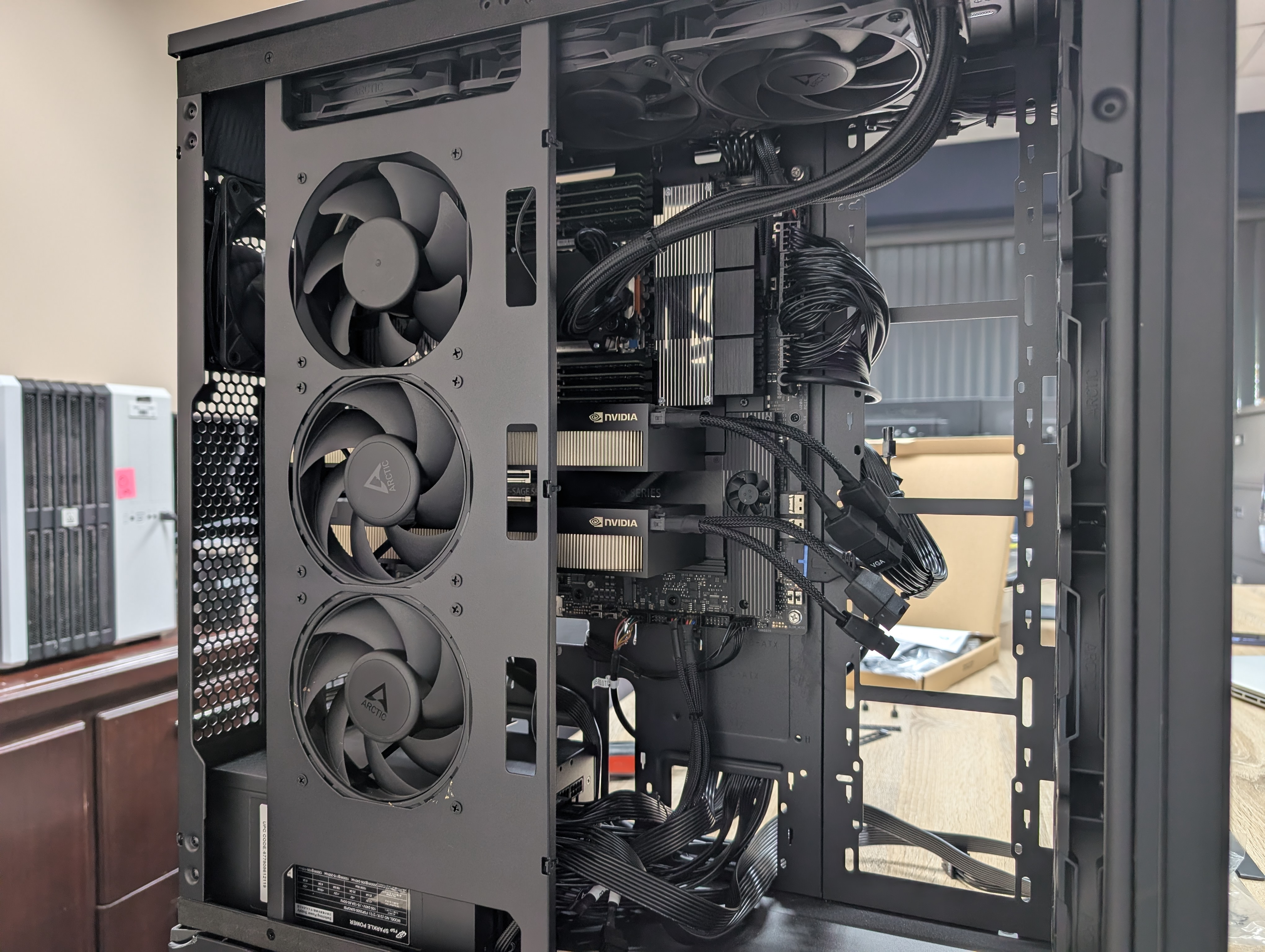 Both NVIDIA GPUs installed side by side inside the case, with power and data cables connected